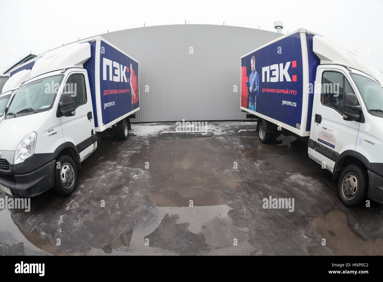 ST. PETERSBURG, RUSSIA - CIRCA JAN, 2016: Wide angle view of light lorries parking lot. Russian transportation company PEC (First expedition company)  Stock Photo