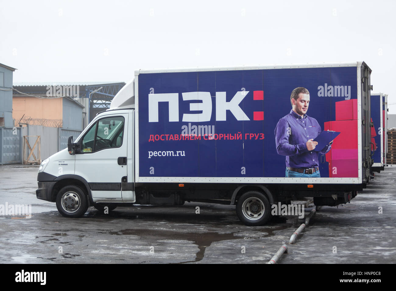 ST. PETERSBURG, RUSSIA - CIRCA JAN, 2016: Several light trucks of Russian transportation company PEC are on parking lot. The PEC (First expedition com Stock Photo