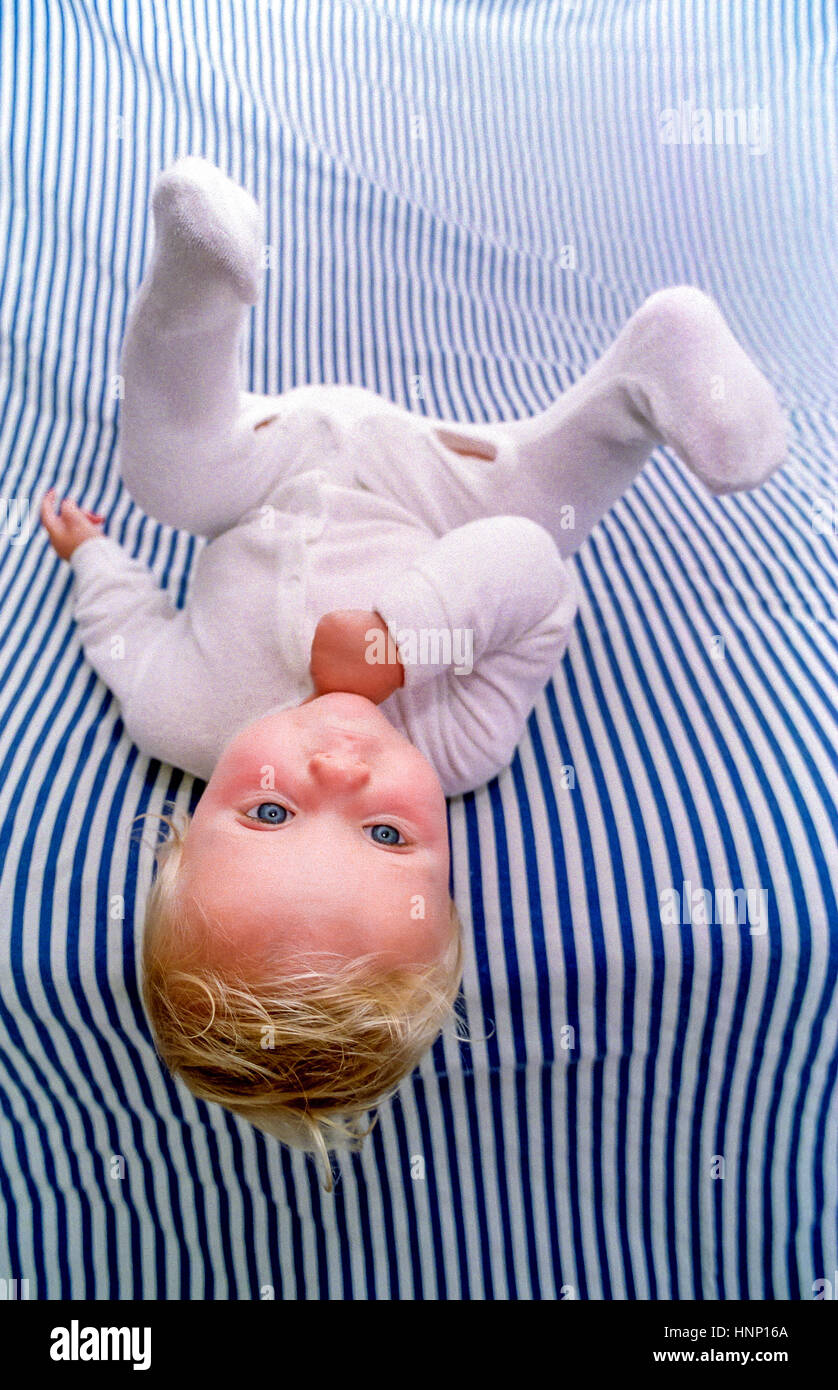 A Baby Laid Out On A Bedsheet Stock Photo Alamy