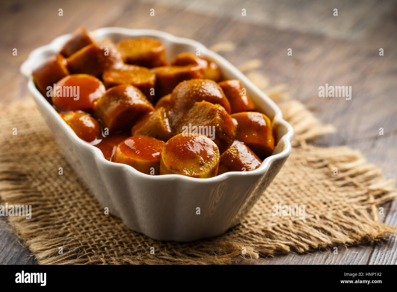 german currywurst - pieces of curried sausage Stock Photo