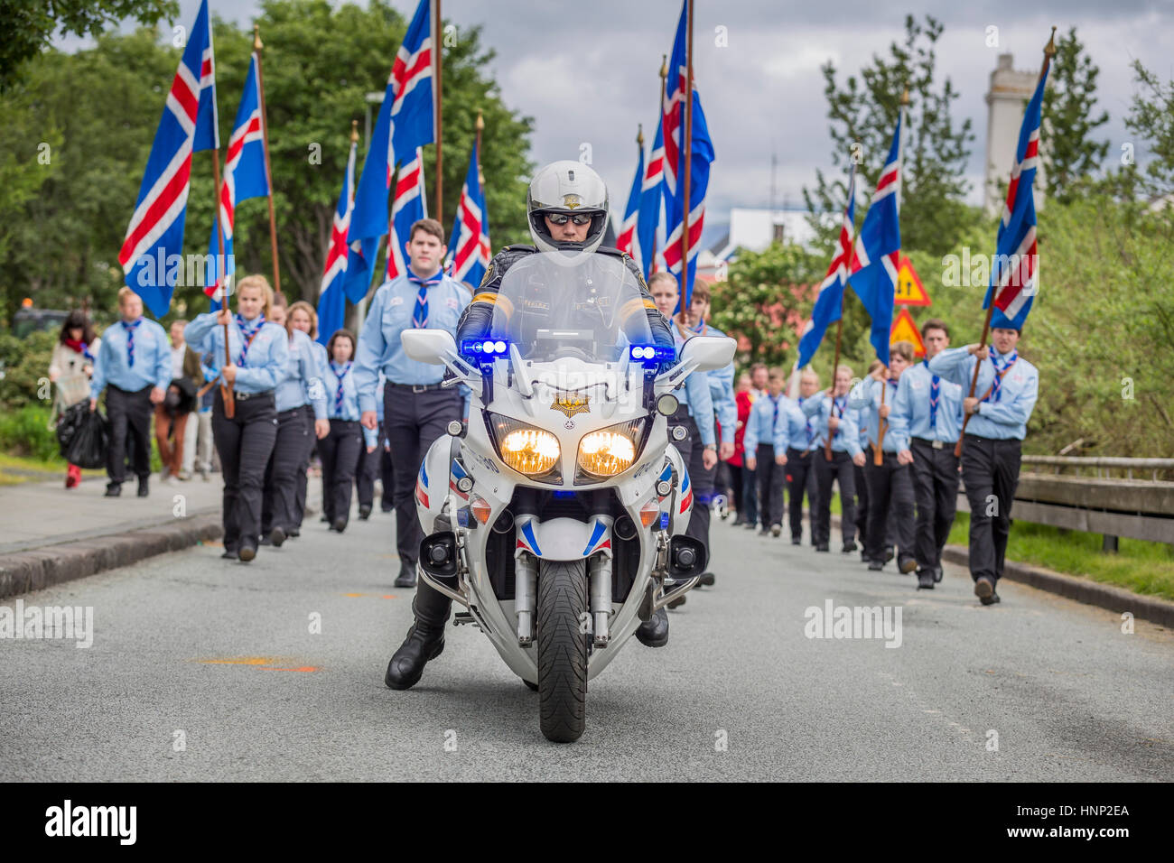 Motorbike leading the Scouts during a parade, Independence day, Reykjavik, Iceland Stock Photo