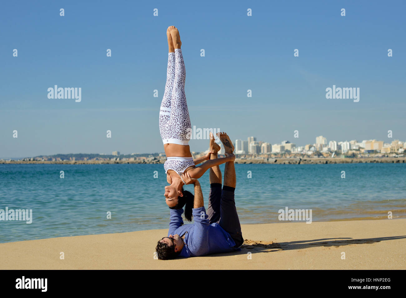 couple doing acro yoga Stock Photo