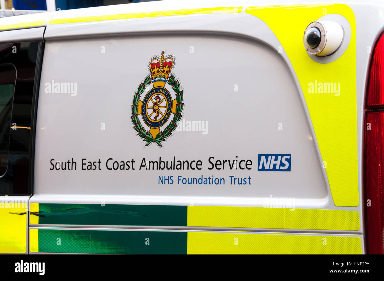 Logo and name of South East Coast Ambulance Service NHS Foundation Trust on the side of a paramedic ambulance. Stock Photo
