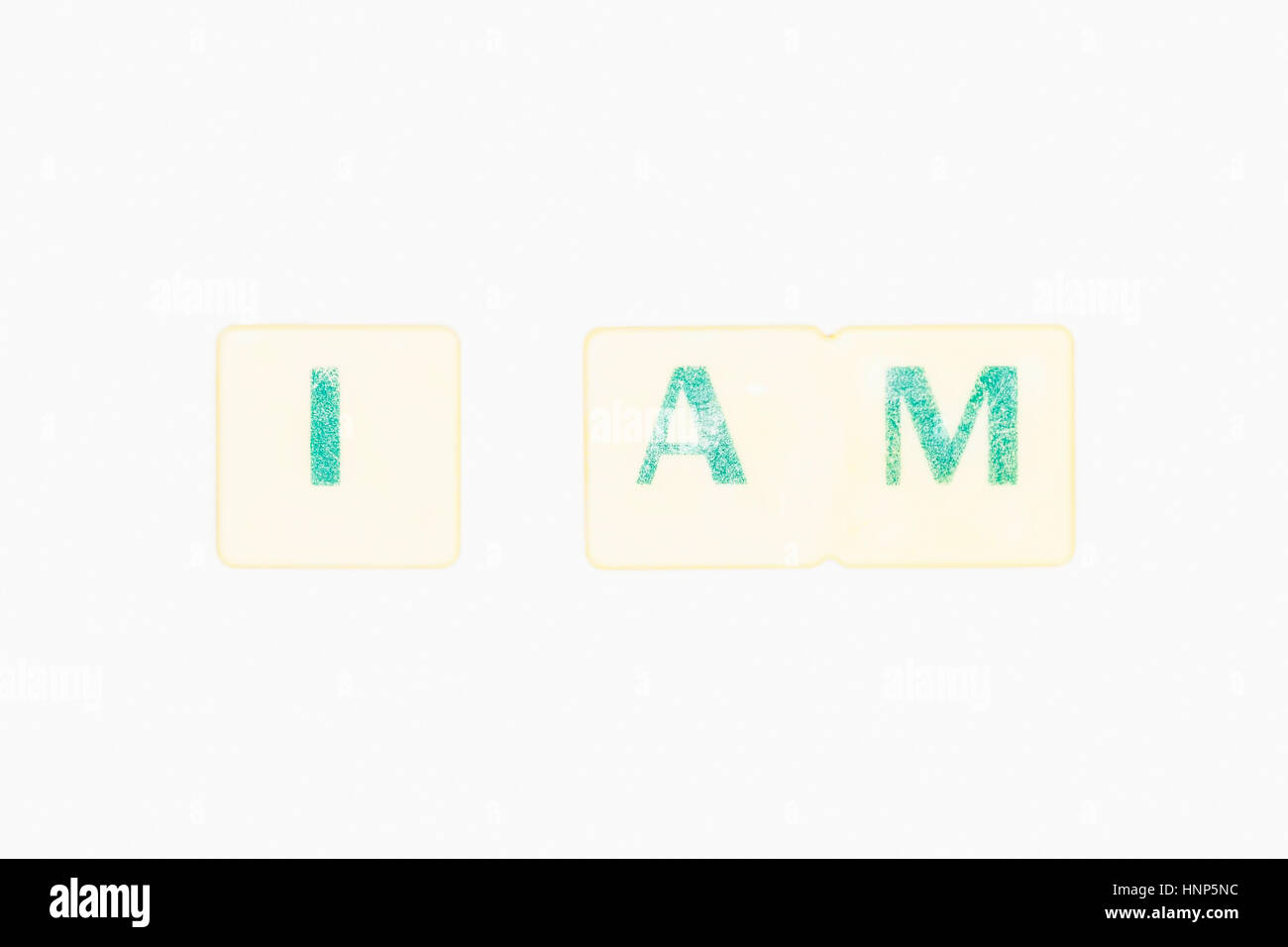 Photo Of Green Letters Forming The Word I Am An English Verb, Word Written On A White Background, Its Basic Meaning Is Exist, Have Being Stock Photo