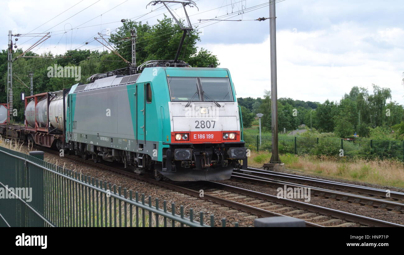 Siemens E186 199 Train entering Venlo, Netherlands with iso container wagons Stock Photo