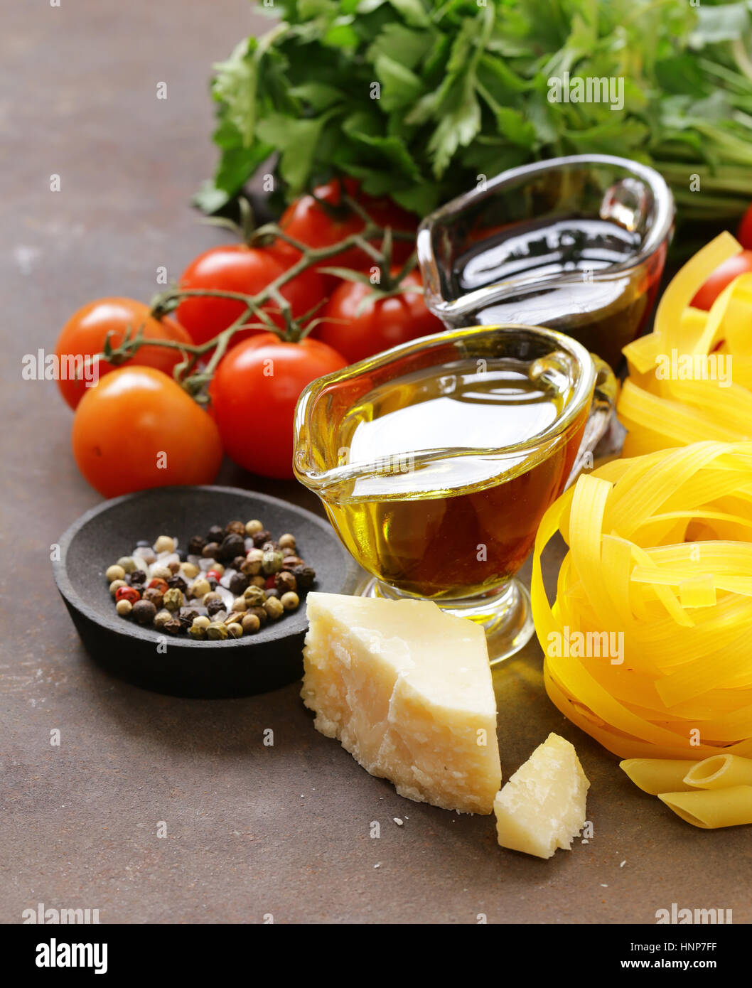 Italian food ingredients - vegetables, olive oil, spices and pasta Stock Photo