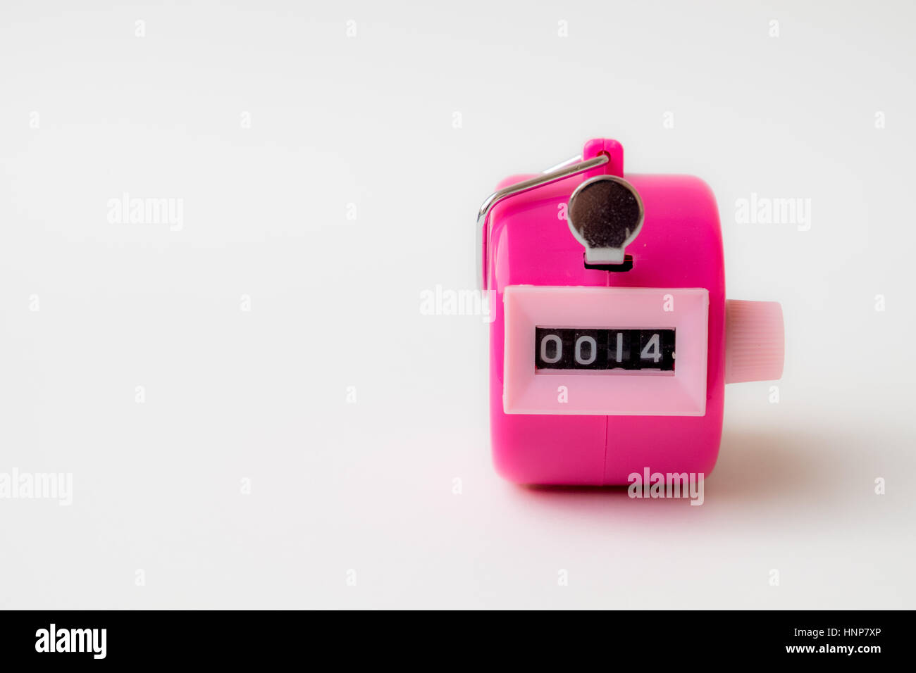 4 digi hand held tally  counter in pink color show number 14 with white background, valentine concept. Stock Photo