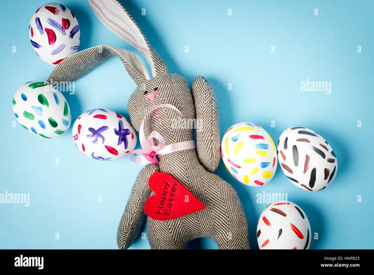 Easter bunny on a blue background Stock Photo - Alamy