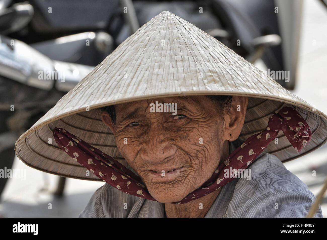 Portrait of an old vendor, Hoi An, Vietnam Stock Photo