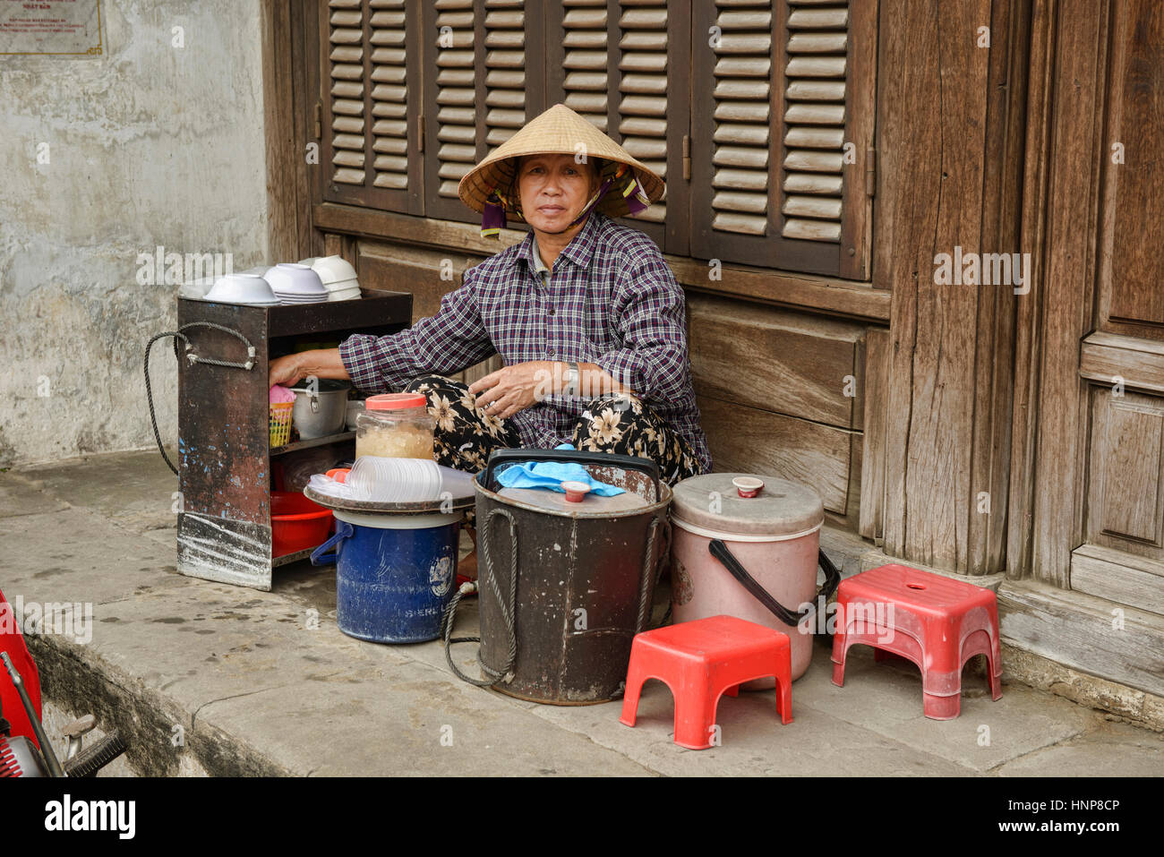 Portrait of a food vendor, Hoi An, Vietnam Stock Photo