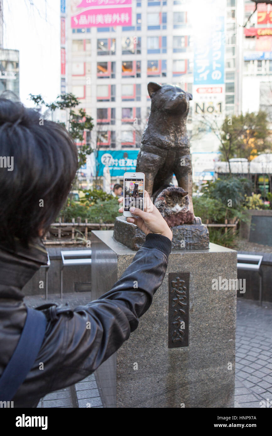 Bronze statue of Akita dog Hachikō ( Hachiko ) at Shibuya station Tokyo , Japan Stock Photo