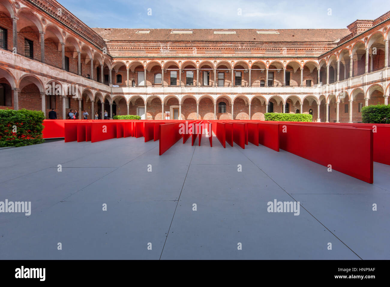 View of the installation 'Red Flowers, designed by Daniel Libeskind for Oikos in the courtyard of the University of Milan for the Milan Design Week 20 Stock Photo