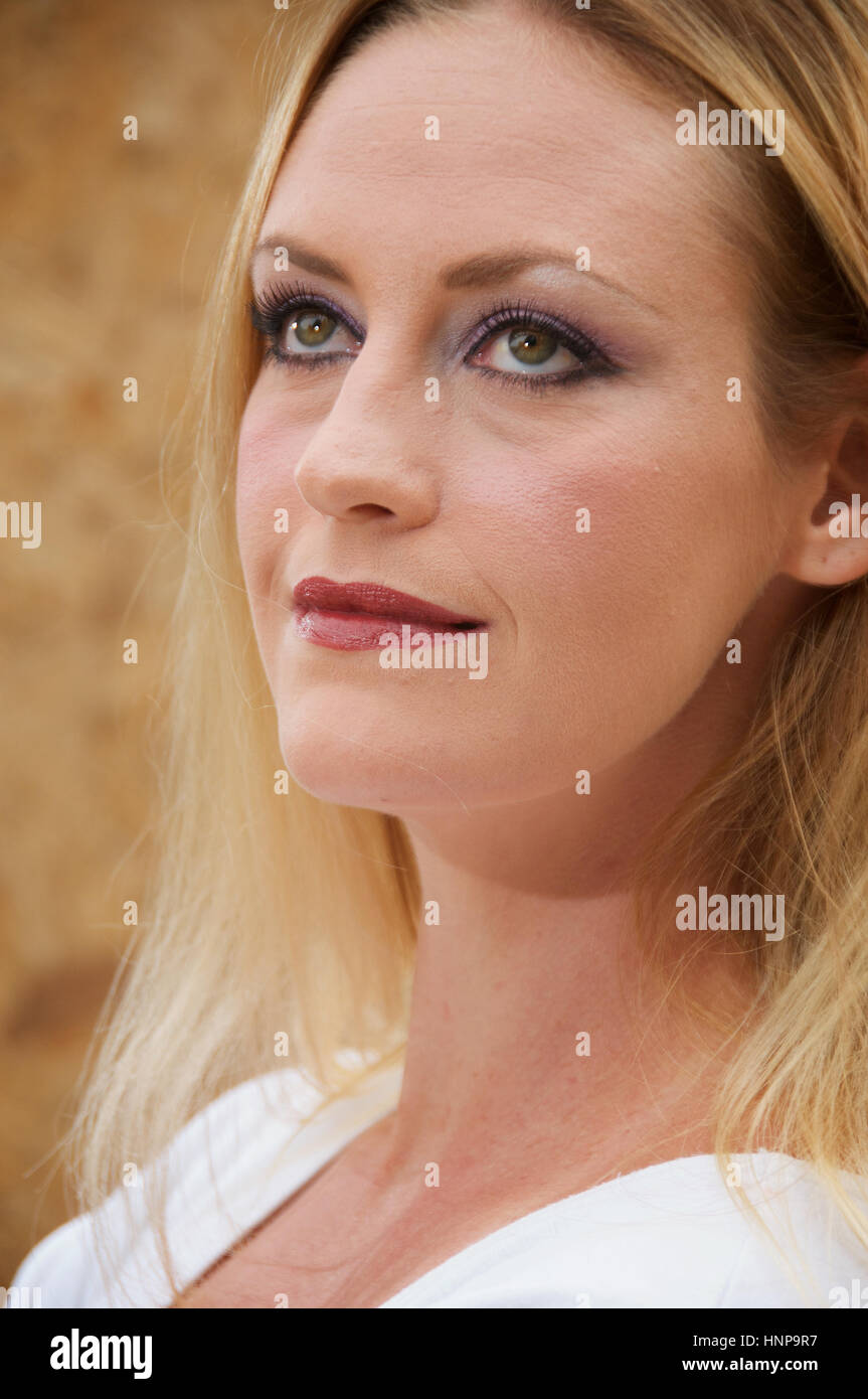 Beautiful blonde haired young woman head and shoulders outside Stock ...