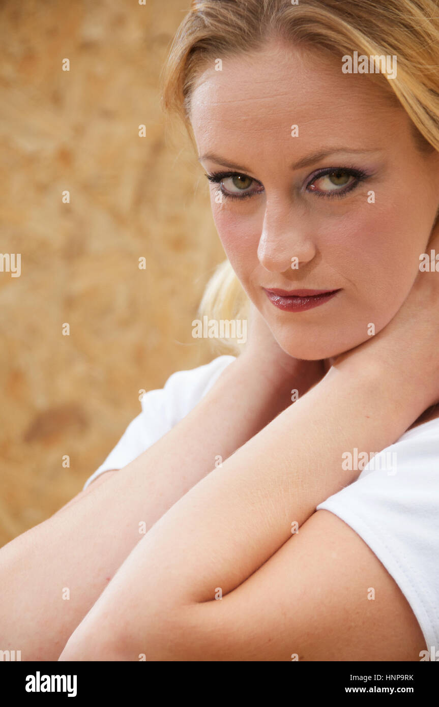 Beautiful blonde haired young woman head and shoulders outside Stock ...
