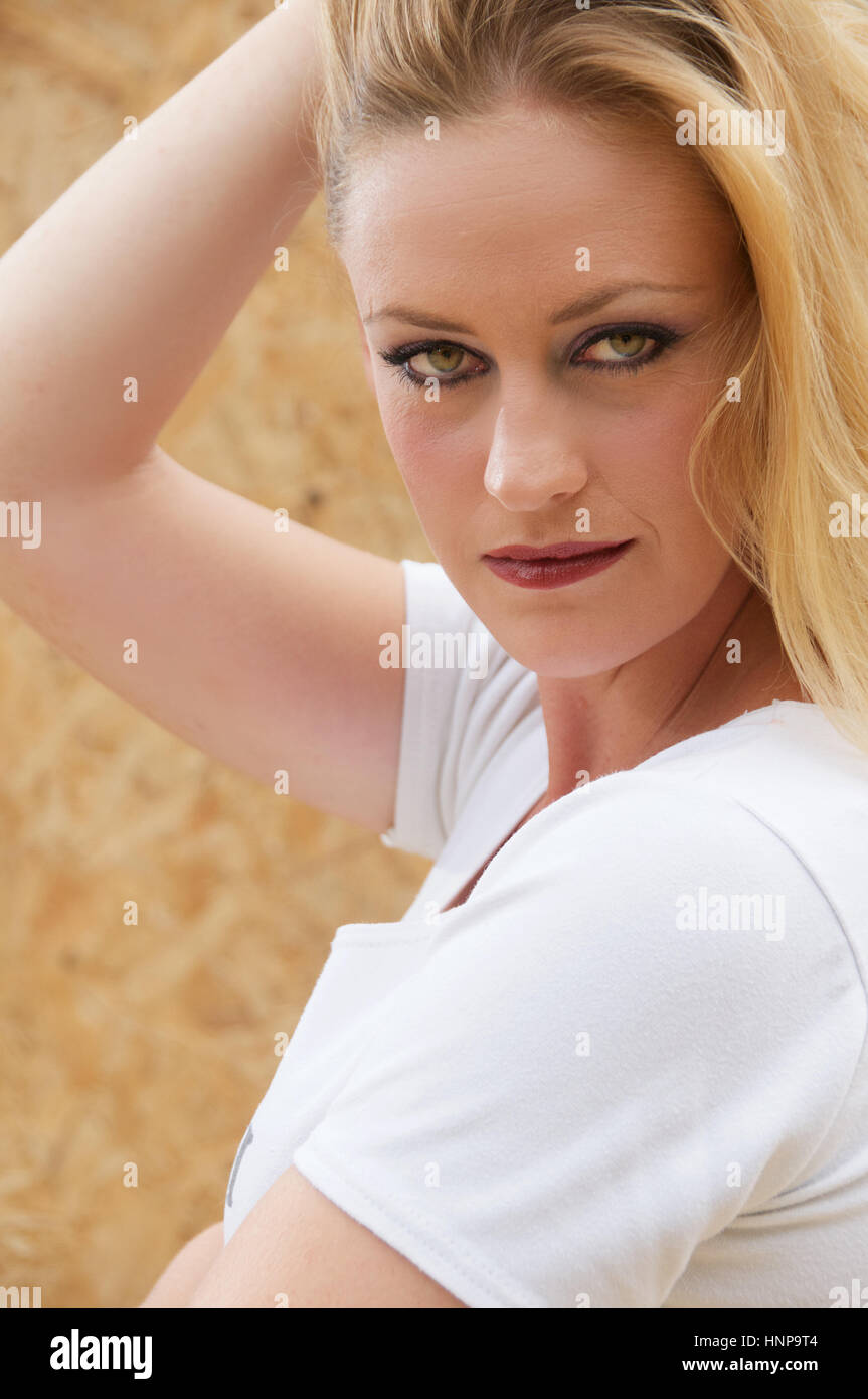 Beautiful blonde haired young woman head and shoulders outside Stock ...