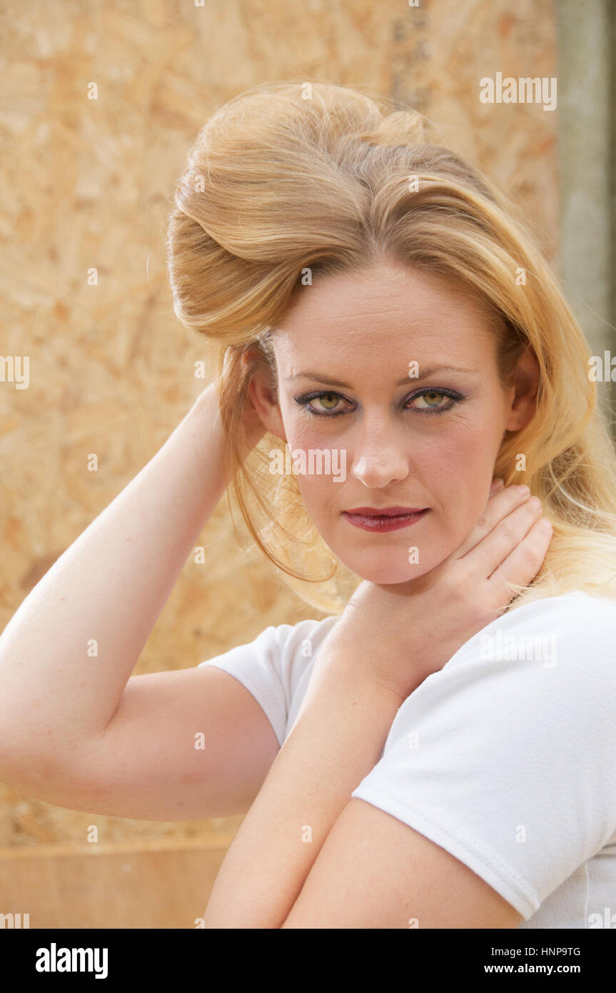 Beautiful blonde haired young woman head and shoulders outside Stock ...