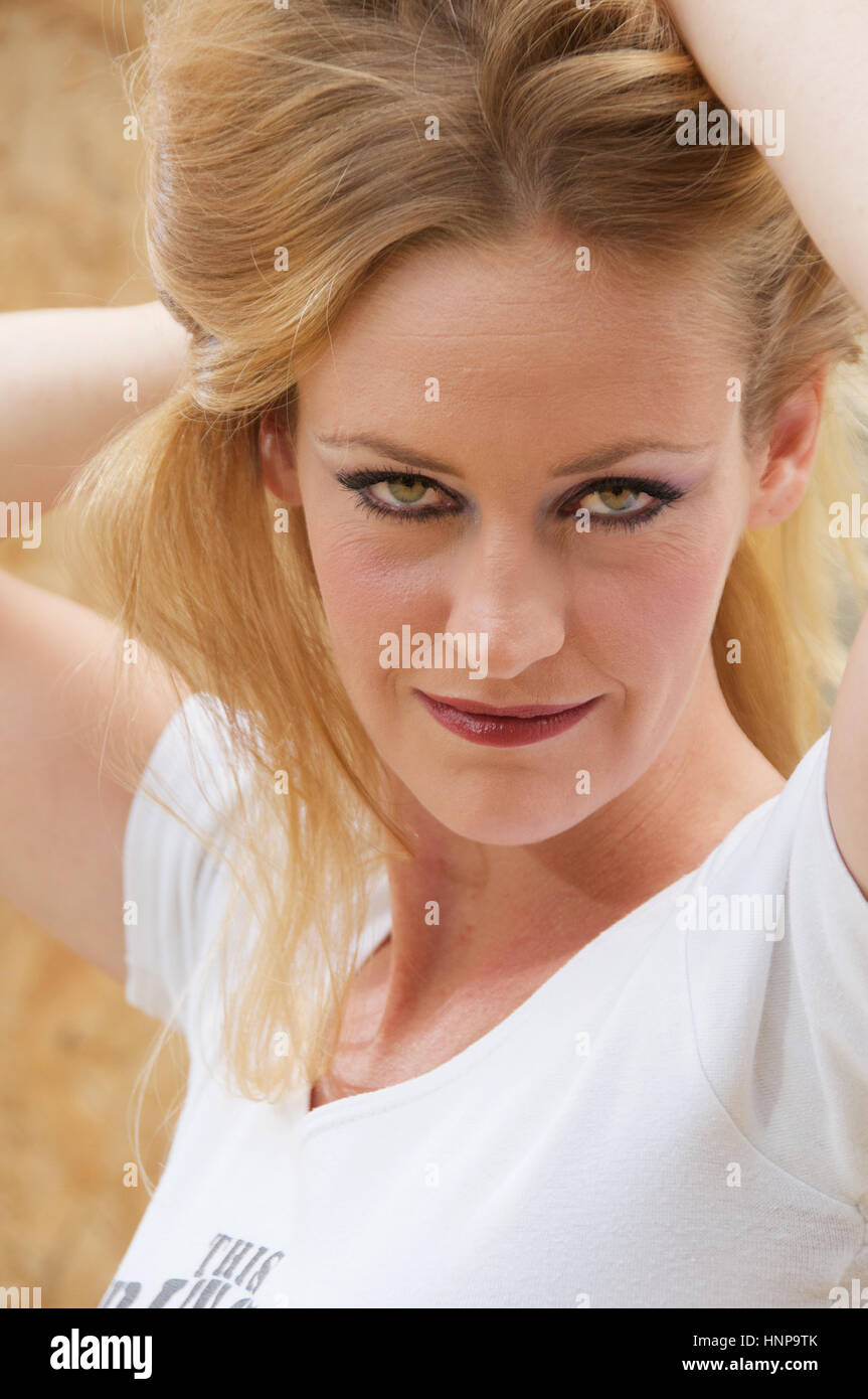 Beautiful blonde haired young woman head and shoulders outside Stock ...