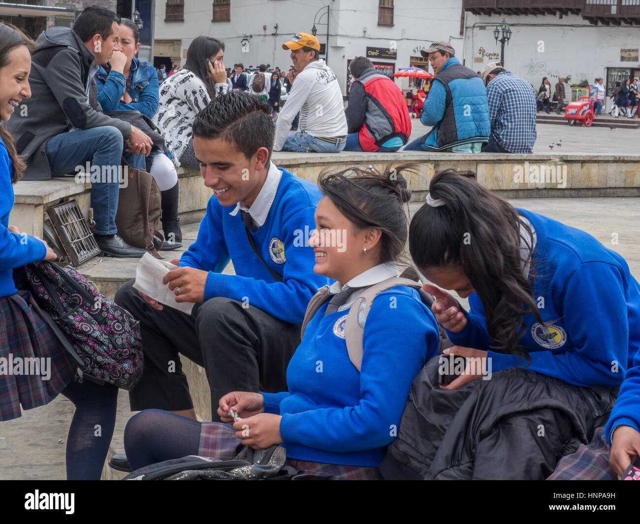 Tunja, Colombia - May 02, 2016: Children from the school wearing the uniforms walking  on the street of the town. Stock Photo