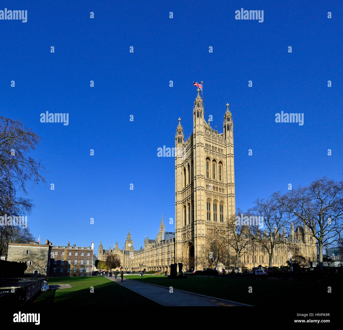 London, England, UK. Houses of Parliament (Victoria Tower) seen from College Green Stock Photo