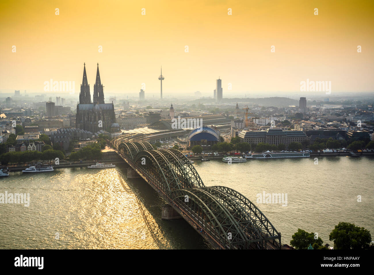 Cityscape with cathedral and steel bridge, Koln, Germany Stock Photo