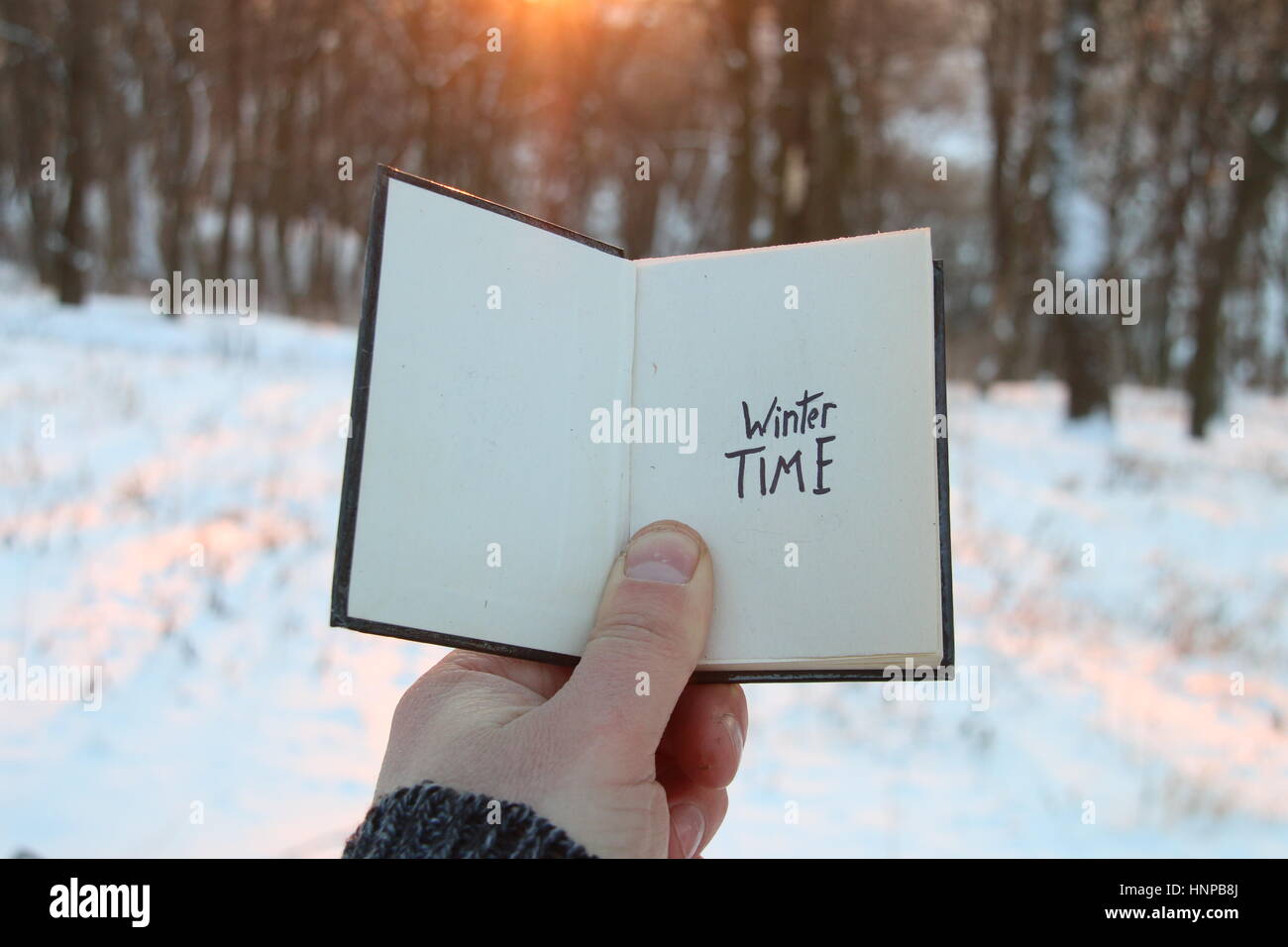 Winter time idea. Book and text. Stock Photo