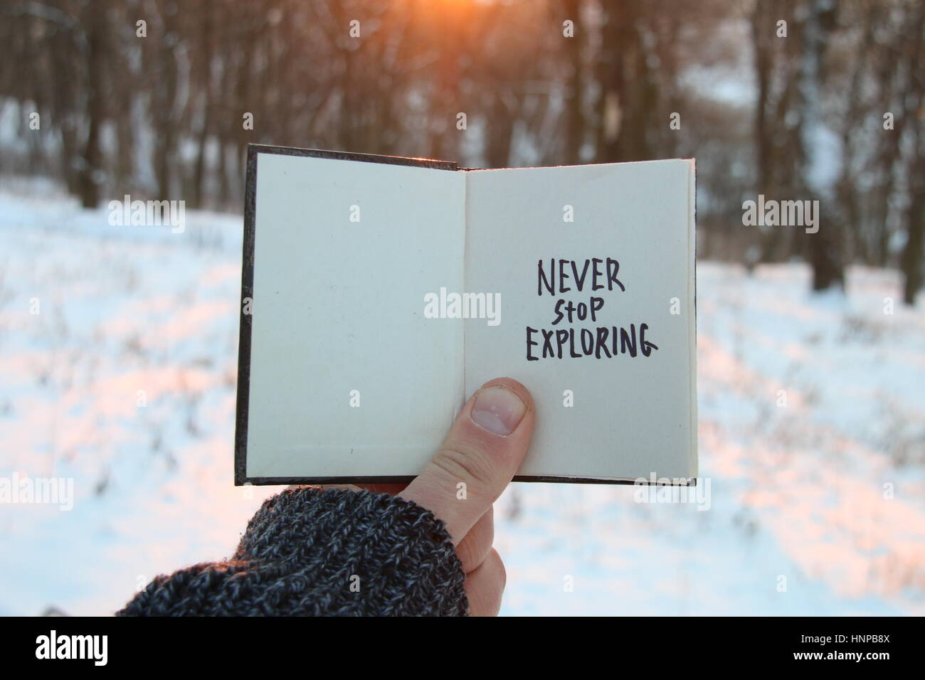 Never stop exploring. Inspirational and motivational quotes. . Book and text. Stock Photo