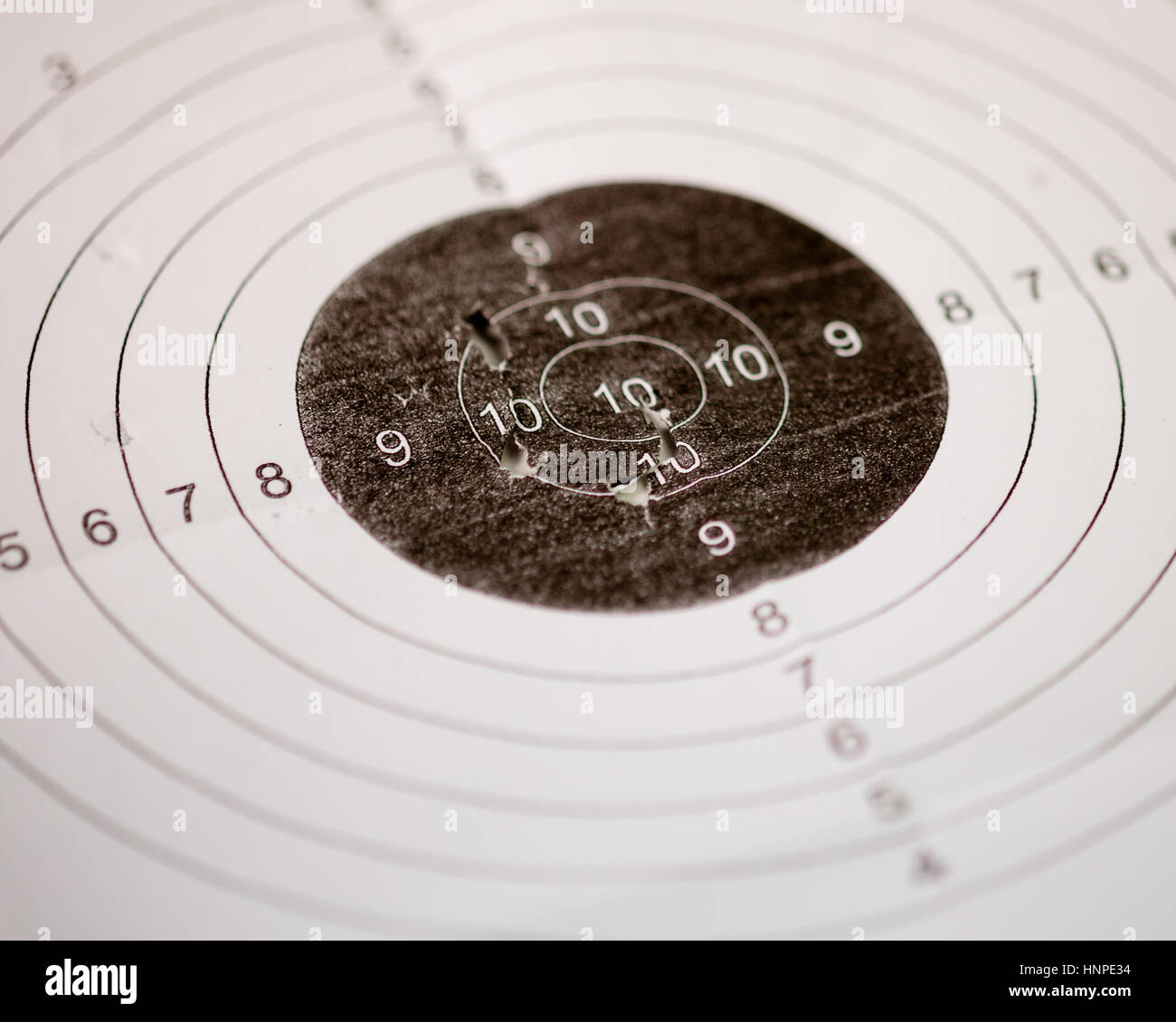Bullet holes in shooting range target Stock Photo