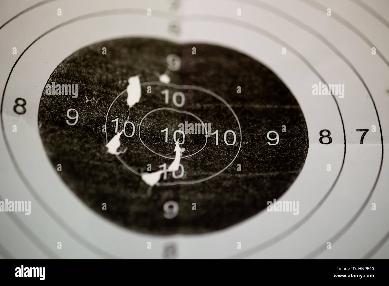 Bullet holes in shooting range target Stock Photo