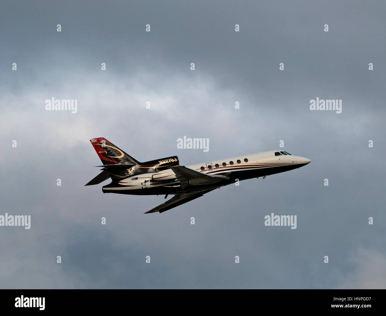 A Dassault Falcon 50 (N227GJ) private business jet airborne after take off from Vancouver International Airport.The aircraft is registered to Black Fa Stock Photo