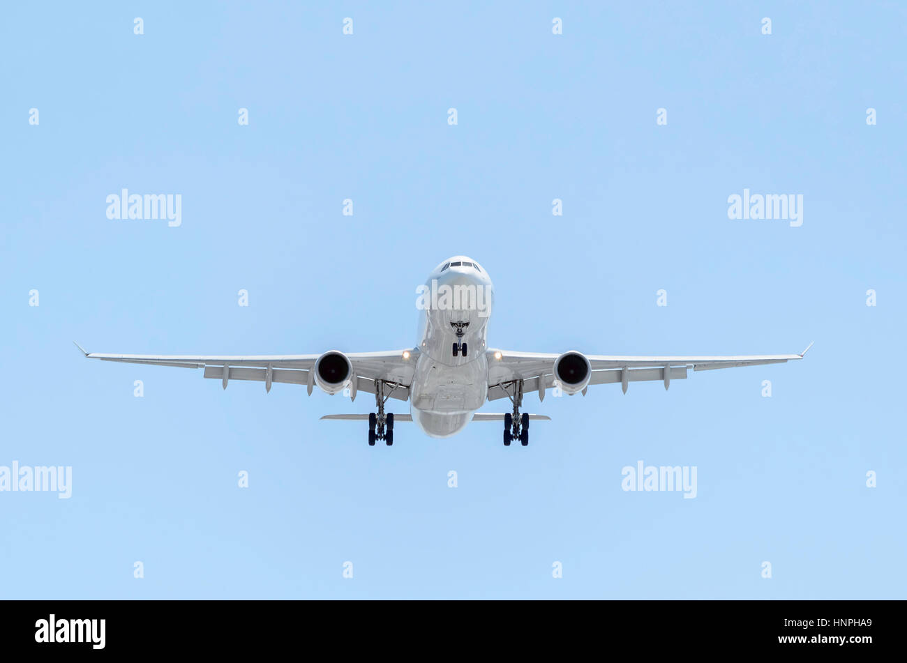 Fully white plane Airbus A330, of Iberia airline, is landing. Spanish