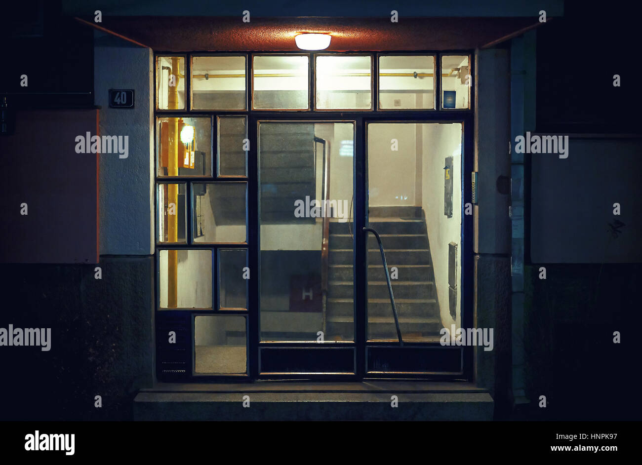 Details of an entrance doors of an old building, night scene. Stock Photo
