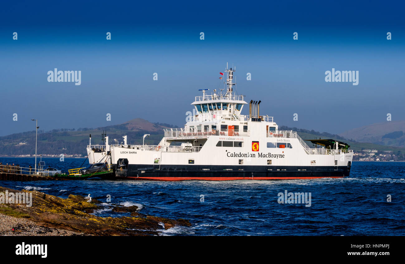 Cars disembark from the  Calmac ferry 'Loch Shira' on the island of Great Cumbrae of the west coast of Scotland Stock Photo