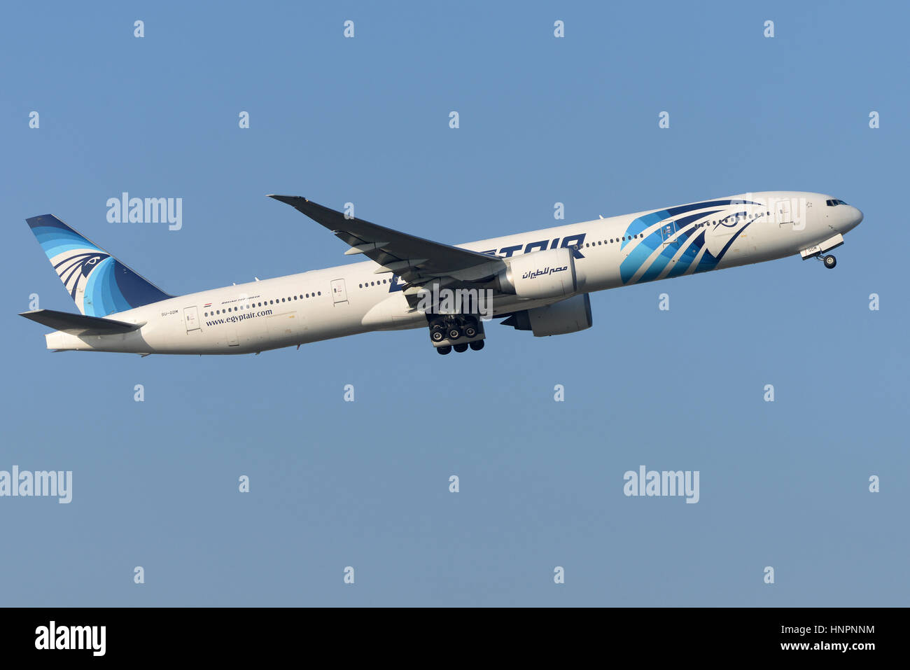Egyptair Boeing 777-36NER SU-GDM taking off from London Heathrow Airport in blue sky Stock Photo