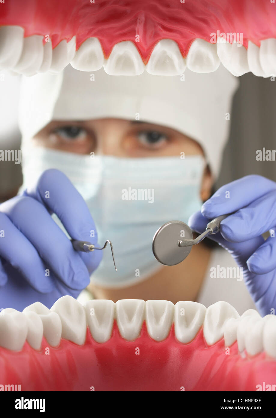 Dentist examining teeth, Inside mouth view. Soft focus Stock Photo