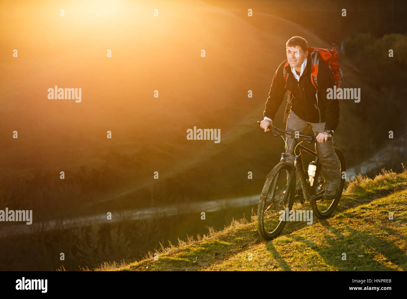 Mountain biker riding on bike in spring inspirational mountains ...