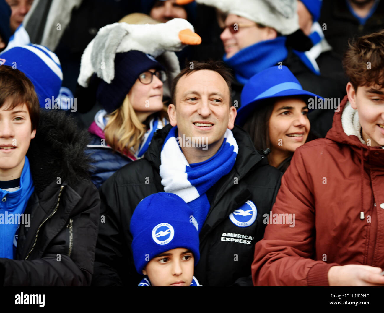 Brighton Football Club chairman Tony Bloom amongst the fans with wife Linda during the Sky Bet Championship match between Brentford and Brighton and Hove Albion at Griffin Park in London. February 5, 2017. Simon  Dack / Telephoto Images Stock Photo