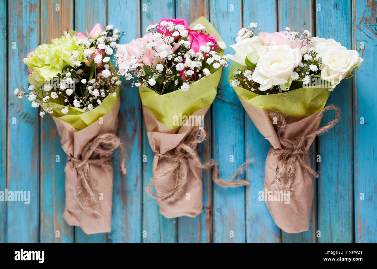 Mini flower bouquet with roses and carnation Stock Photo - Alamy