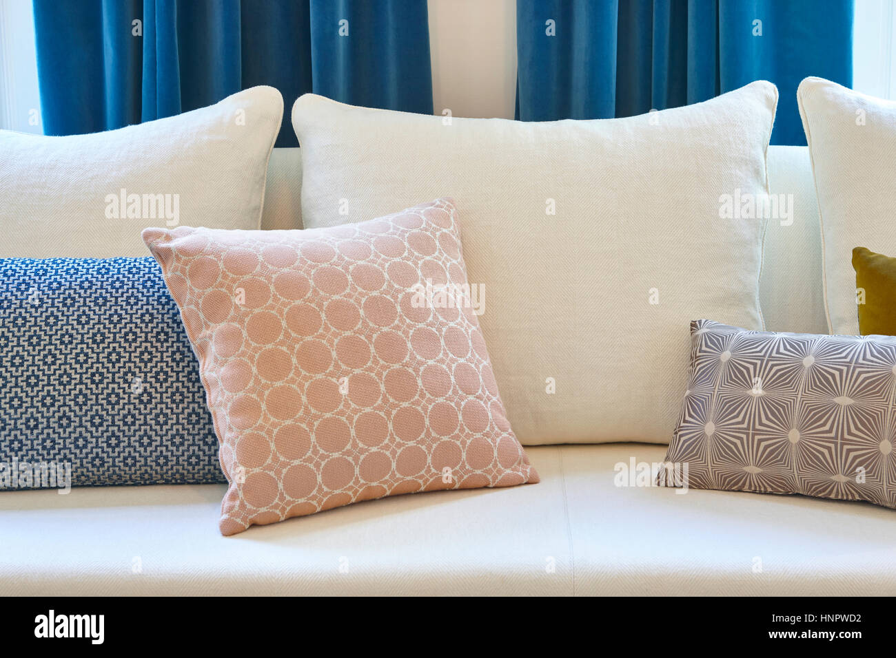 White Sofa With Cushions And Blue Curtains Decoration Interior
