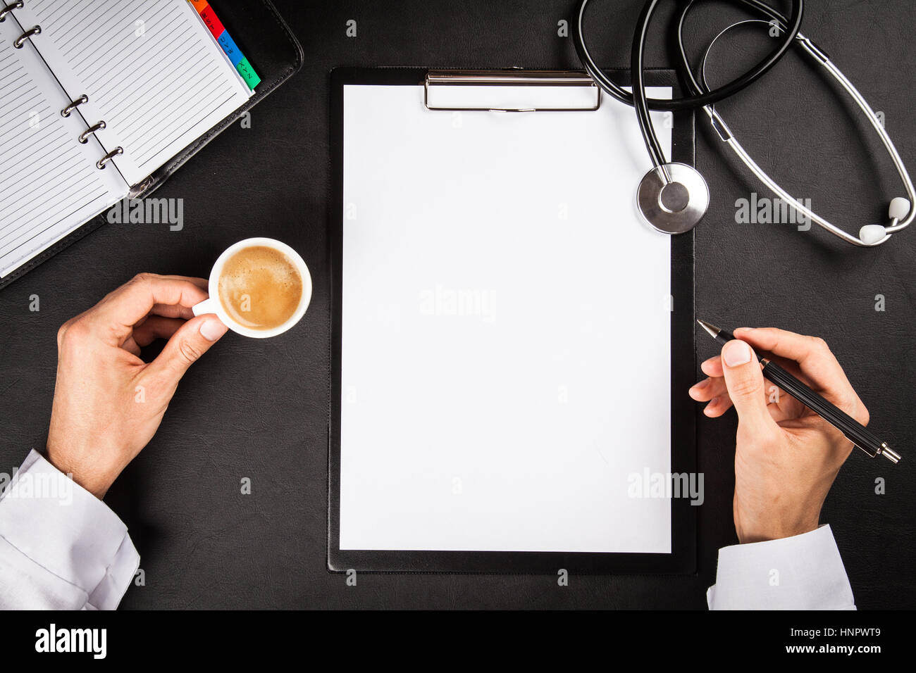 Doctor's working table Stock Photo - Alamy