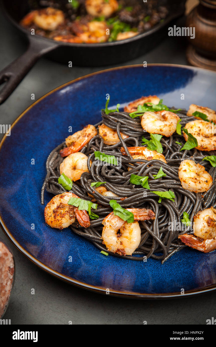 Black pasta with shrimps Stock Photo - Alamy