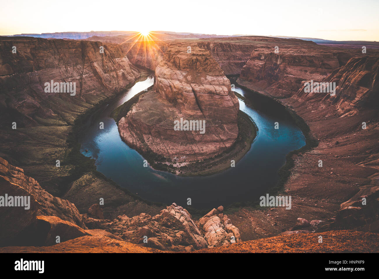 Classic wide-angle view of famous Horseshoe Bend, a horseshoe-shaped meander of the Colorado River in beautiful evening light at sunset, Arizona, USA Stock Photo