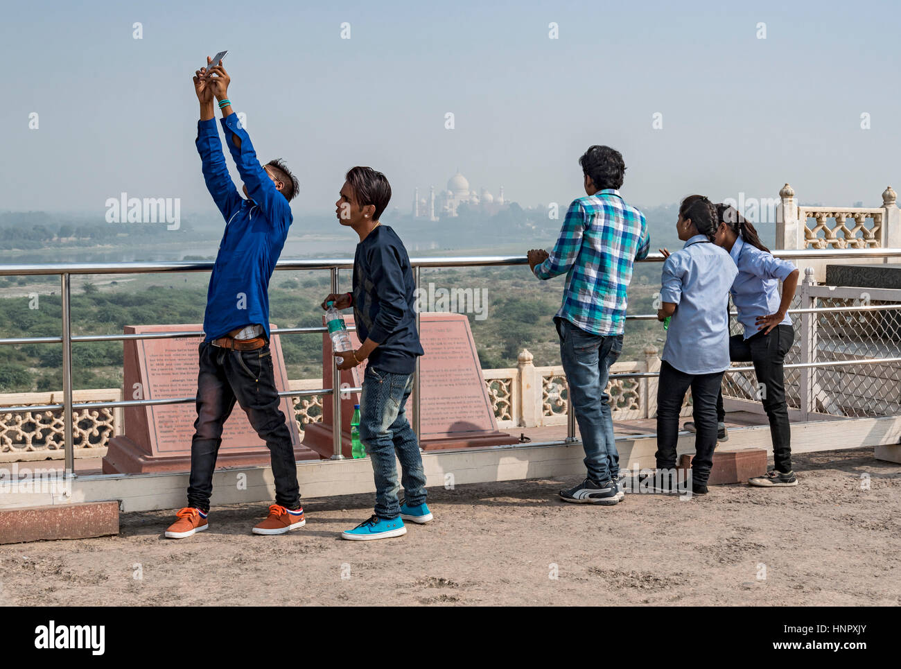 Indian teenagers take selfies with the Taj Mahal, Agra Fort, India Stock Photo