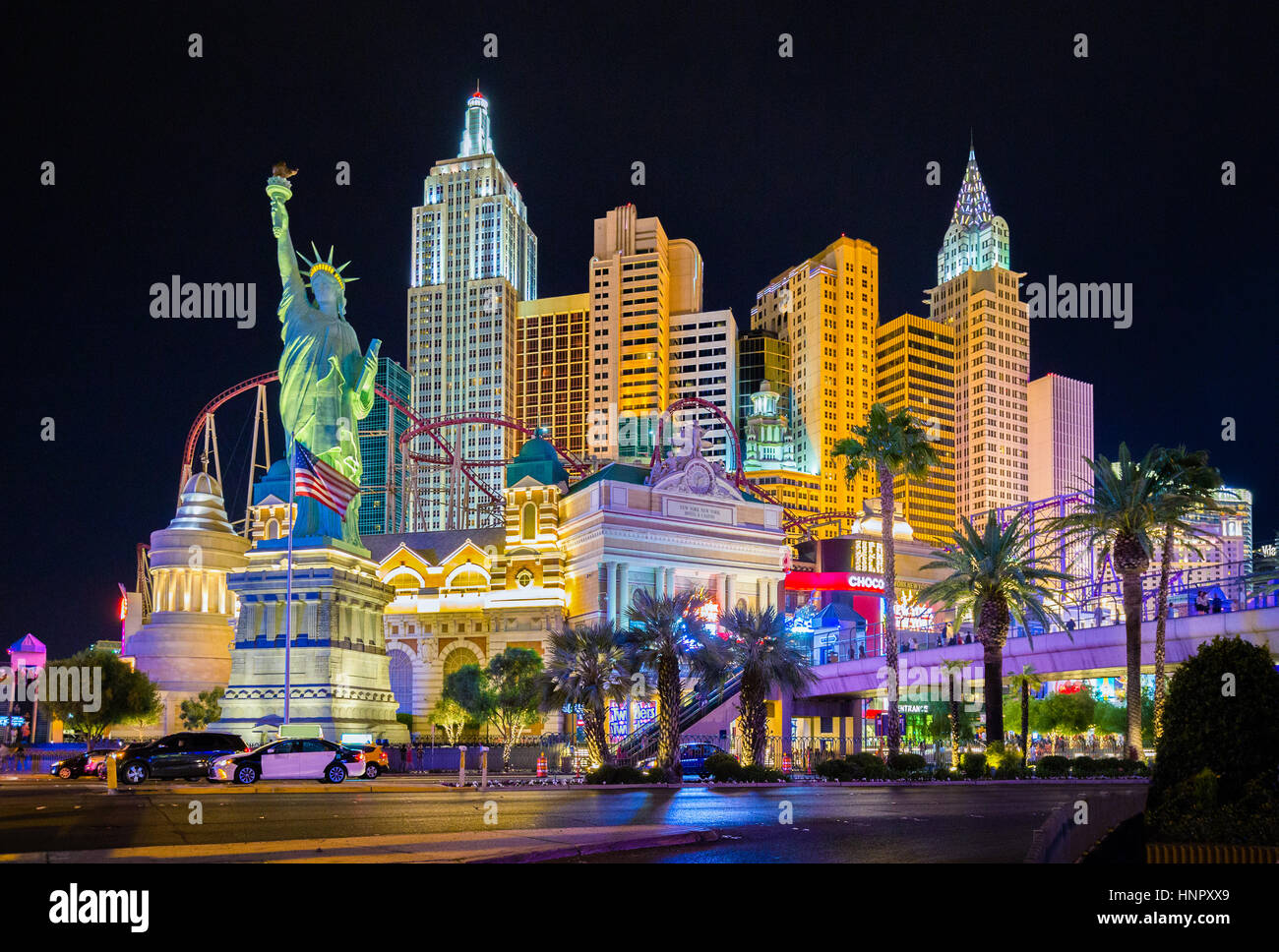 Classic panoramic view of colorful Downtown Las Vegas with world famous Strip and New York New York hotel and casino complex illuminated at night, USA Stock Photo