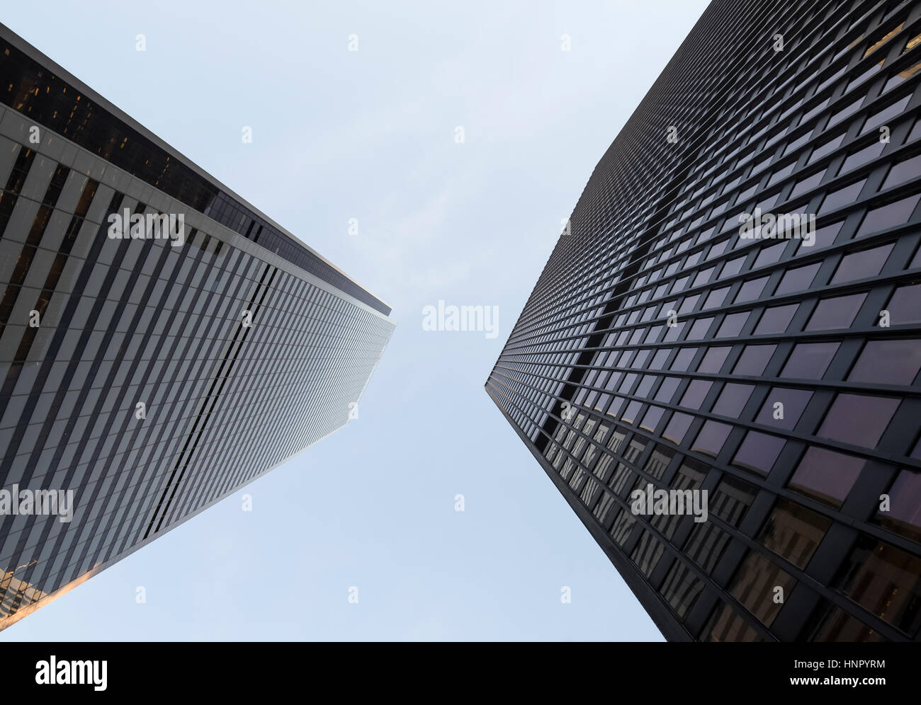 Two office towers in the financial district of Toronto Canada appear to be leaning towards one another. Stock Photo