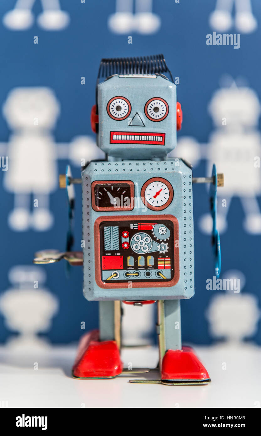 A vintage wind up toy robot, painted in blue and red Stock Photo - Alamy