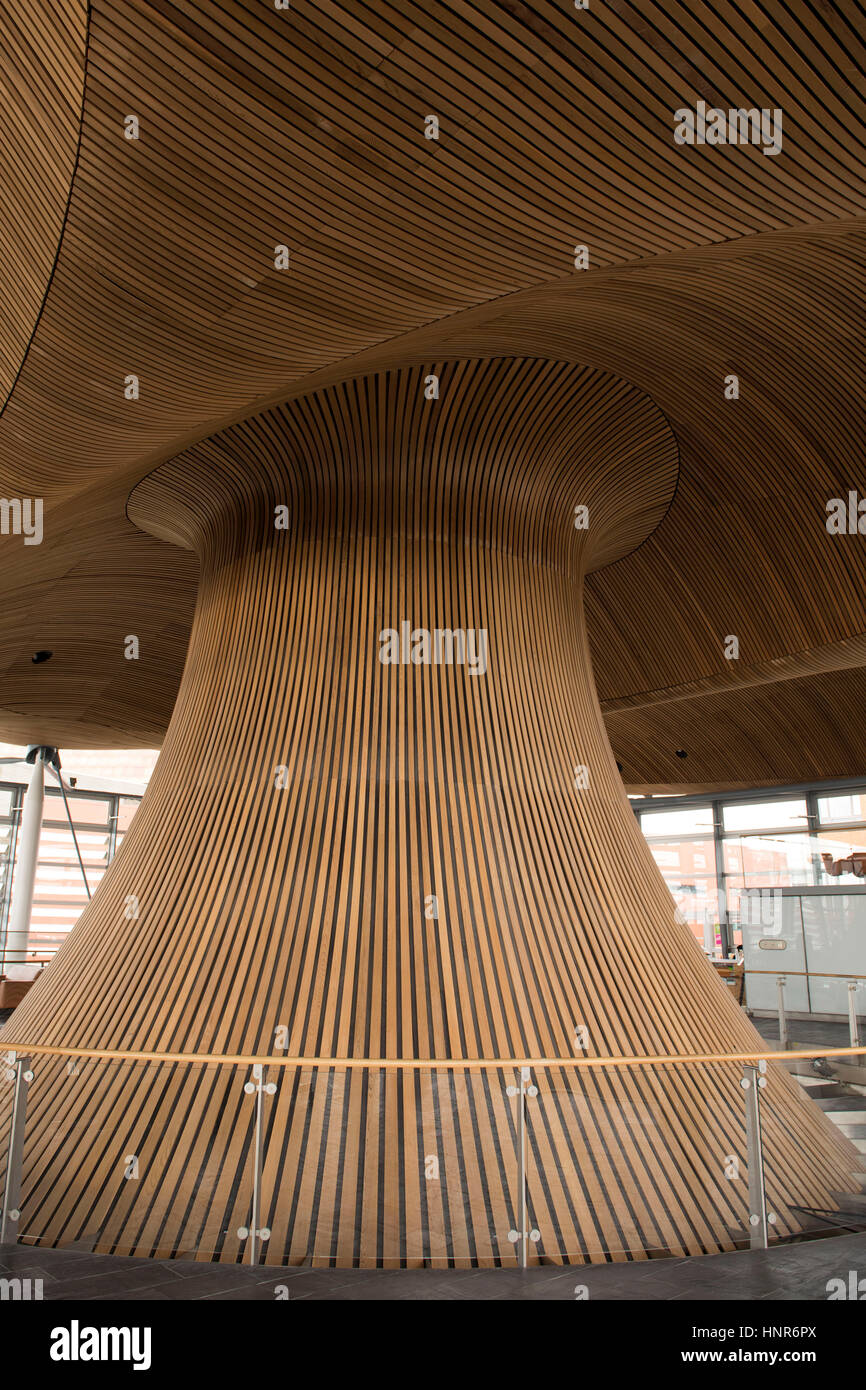 A general view of interior woodwork on the ceiling and funnel of the Senedd, home of the Welsh Assembly, in Cardiff Bay, South Wales, UK. Stock Photo