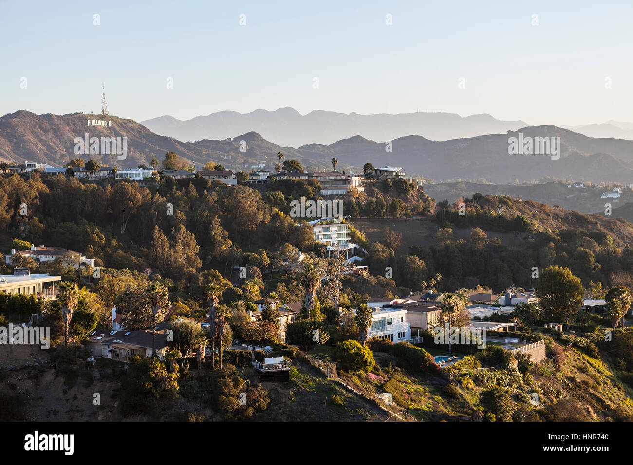 Los Angeles, California, USA - January 1, 2015:  Hollywood Hills homes and the Hollywood Sign in the Santa Monica Mountains above Los Angeles. Stock Photo