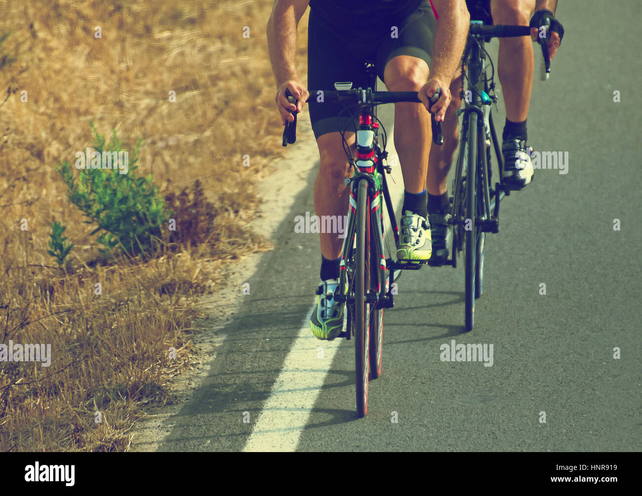 Road Riding Cyclists riding on highway hi-res stock photography and images - Alamy