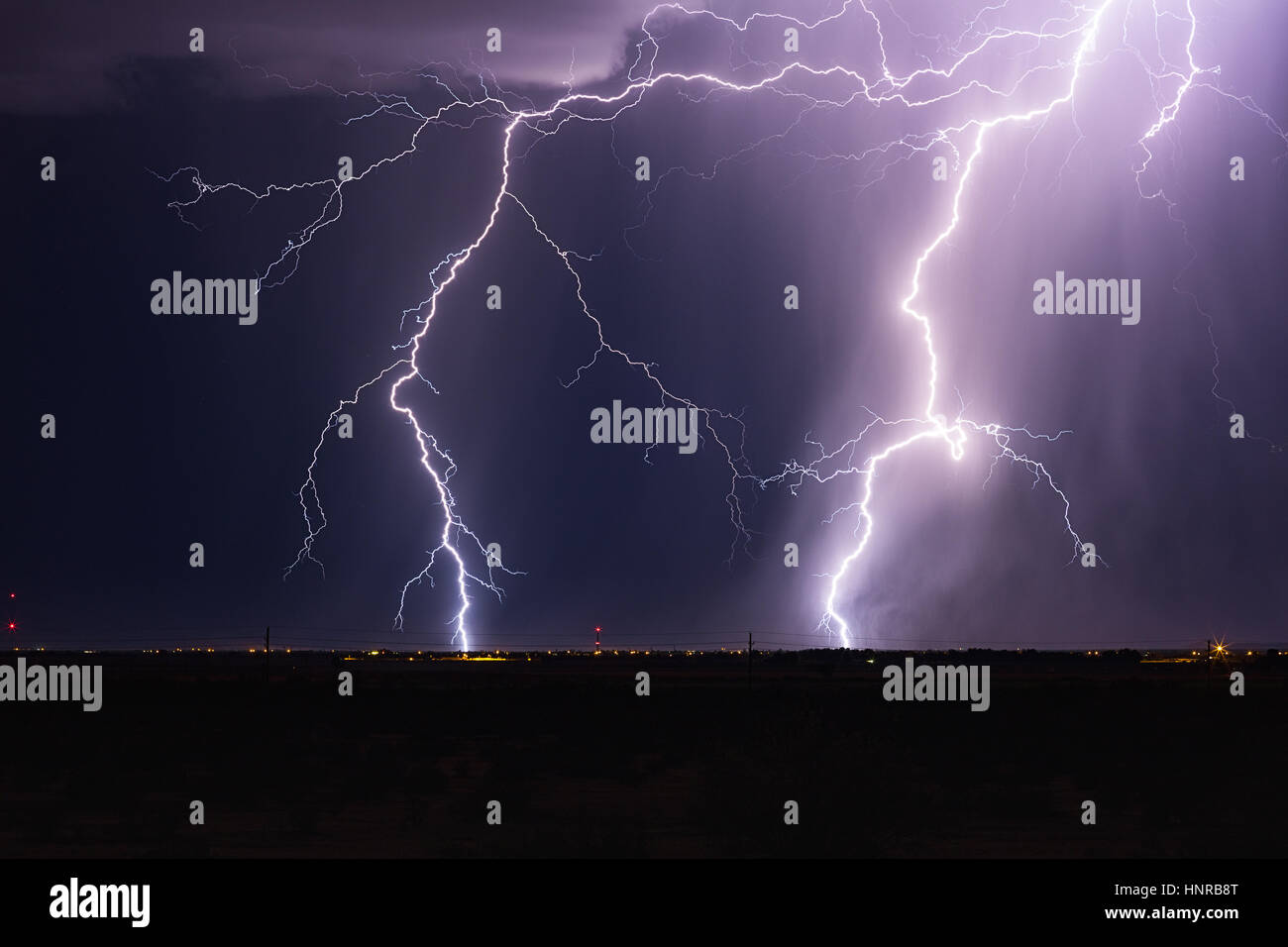 Dramatic lightning strike in a storm at night Stock Photo