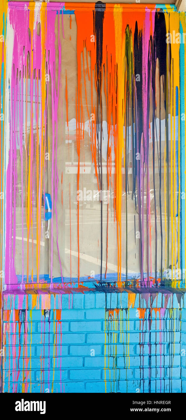 Colorfully streaked abandoned storefront. Stock Photo